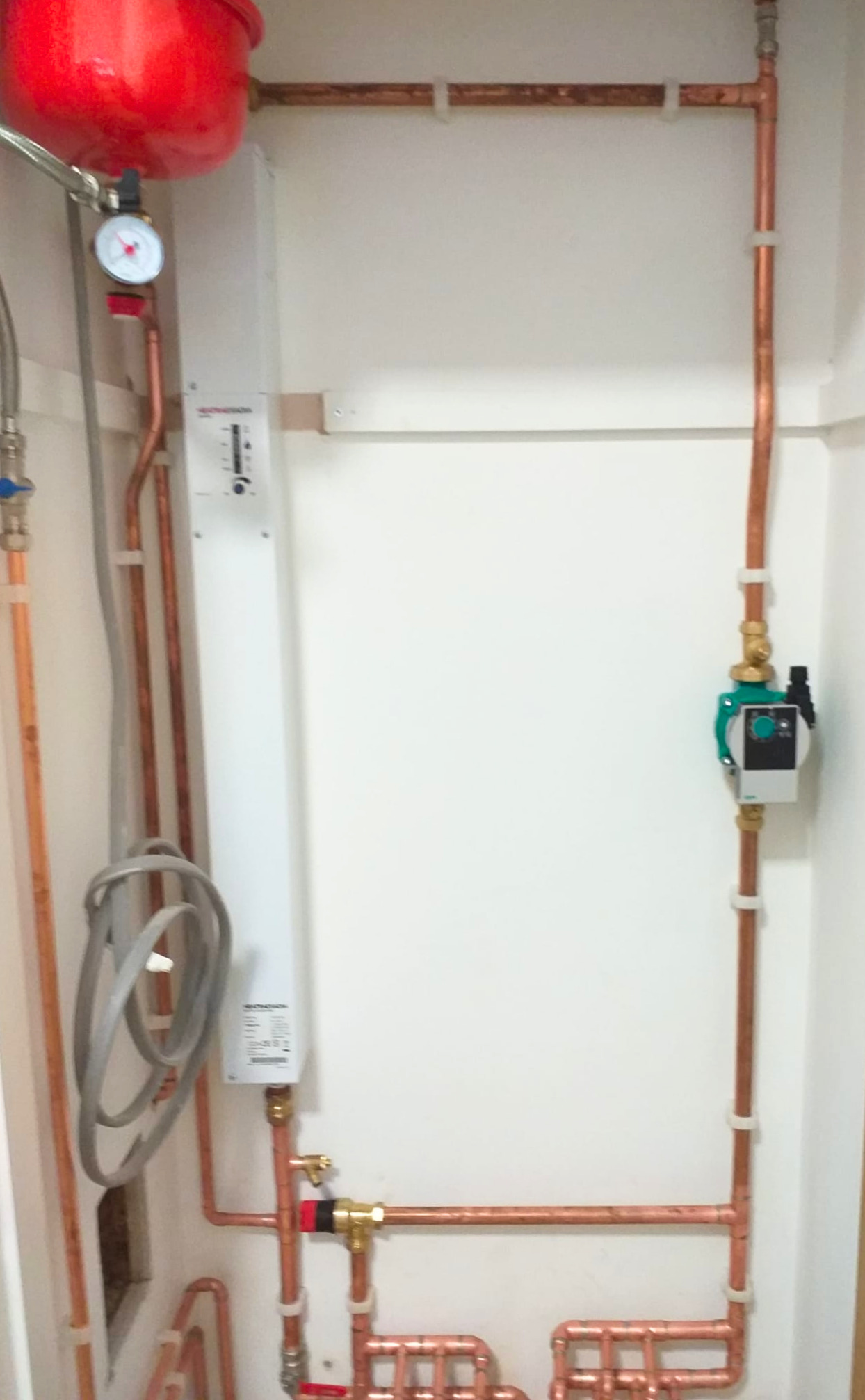 Central heating system installation with expansion vessel and circulation pump in Ashford