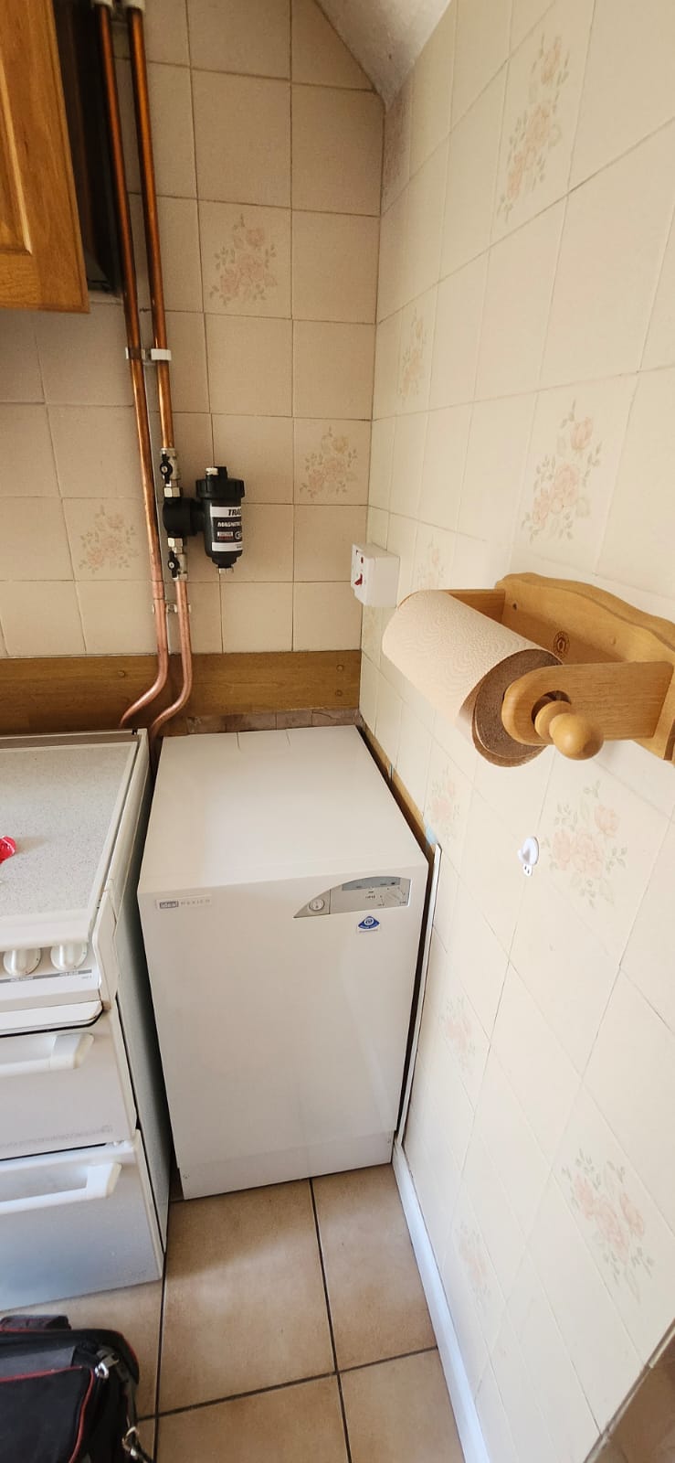 Magnetic filter fitted to copper pipework above a new floor-standing boiler in Gillingham