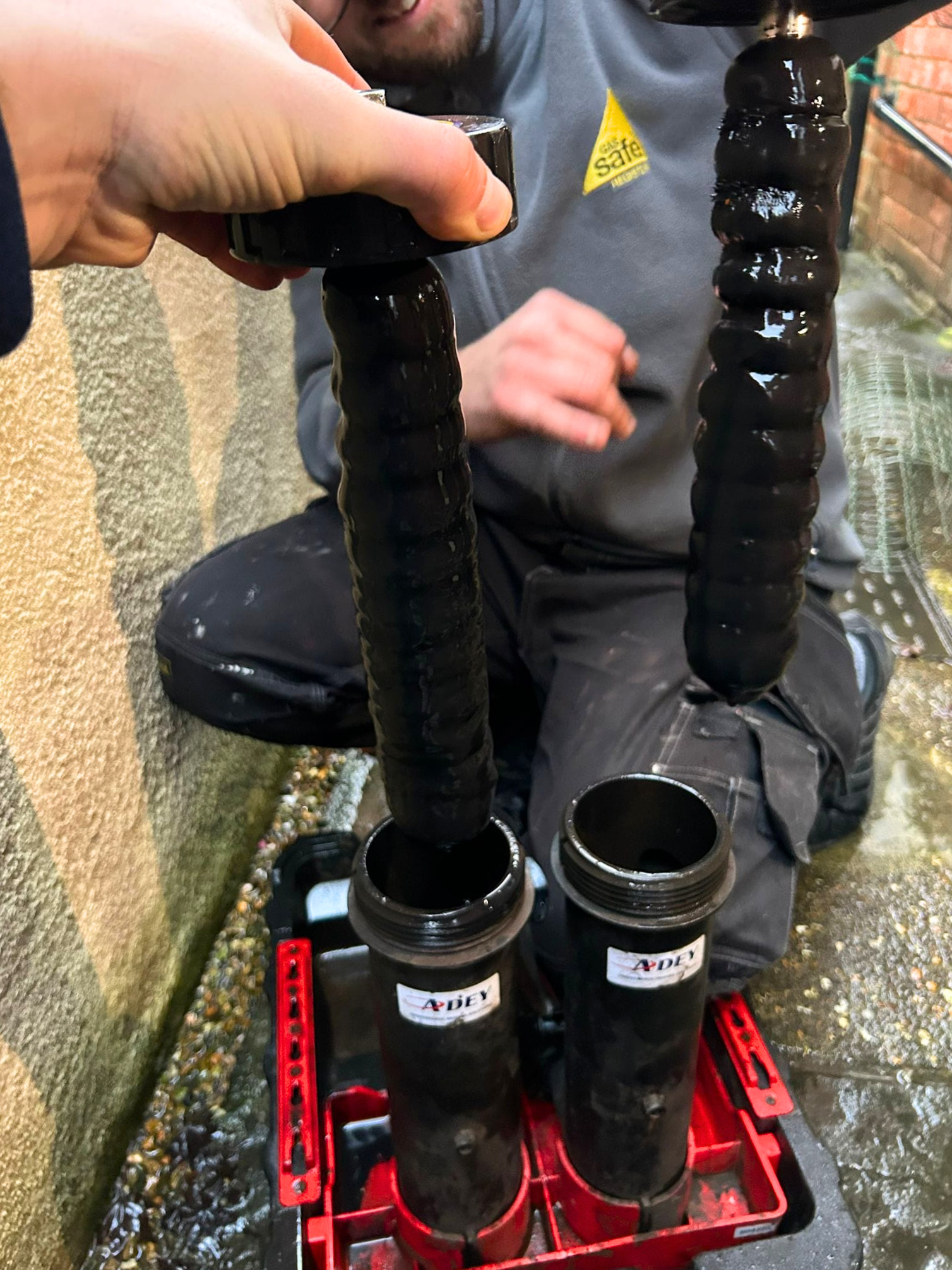 Magnetic filter removed showing sludge captured after a power flush in Tonbridge — after