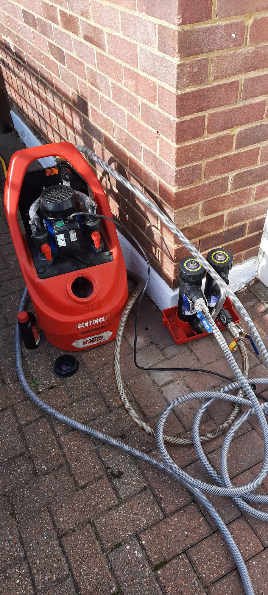 Power flush machine connected to a central heating system in Tonbridge — before